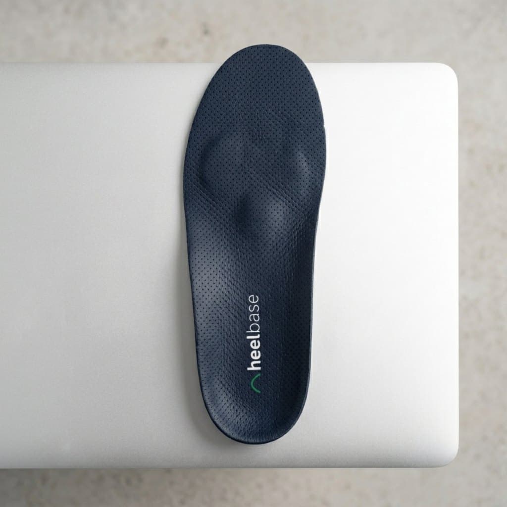 HeelBase Drive insole top view on mixed background