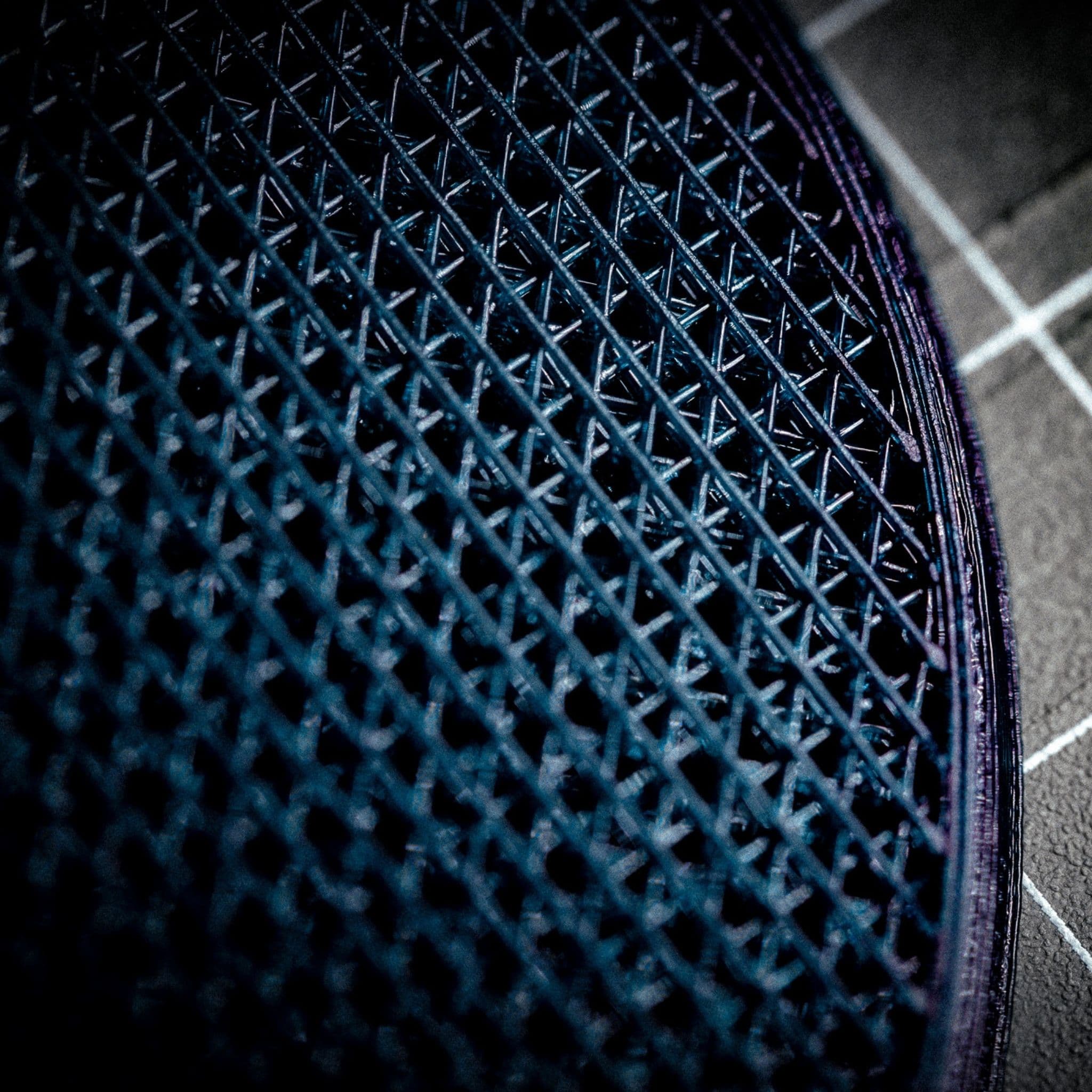 Macro close-up of the open lattice and precision-printed edge inside a HeelBase Drive insole