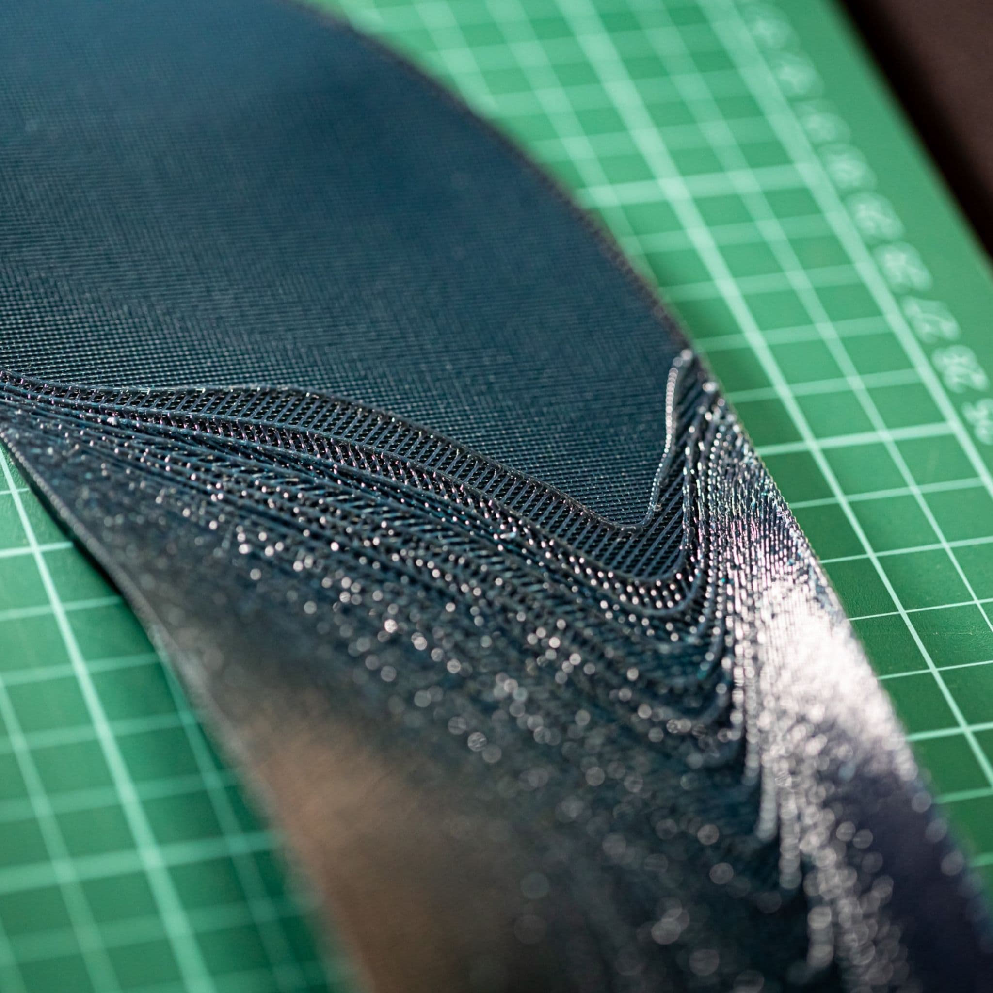 Close-up of the precision-printed edge and continuous lattice structure of a HeelBase Drive insole