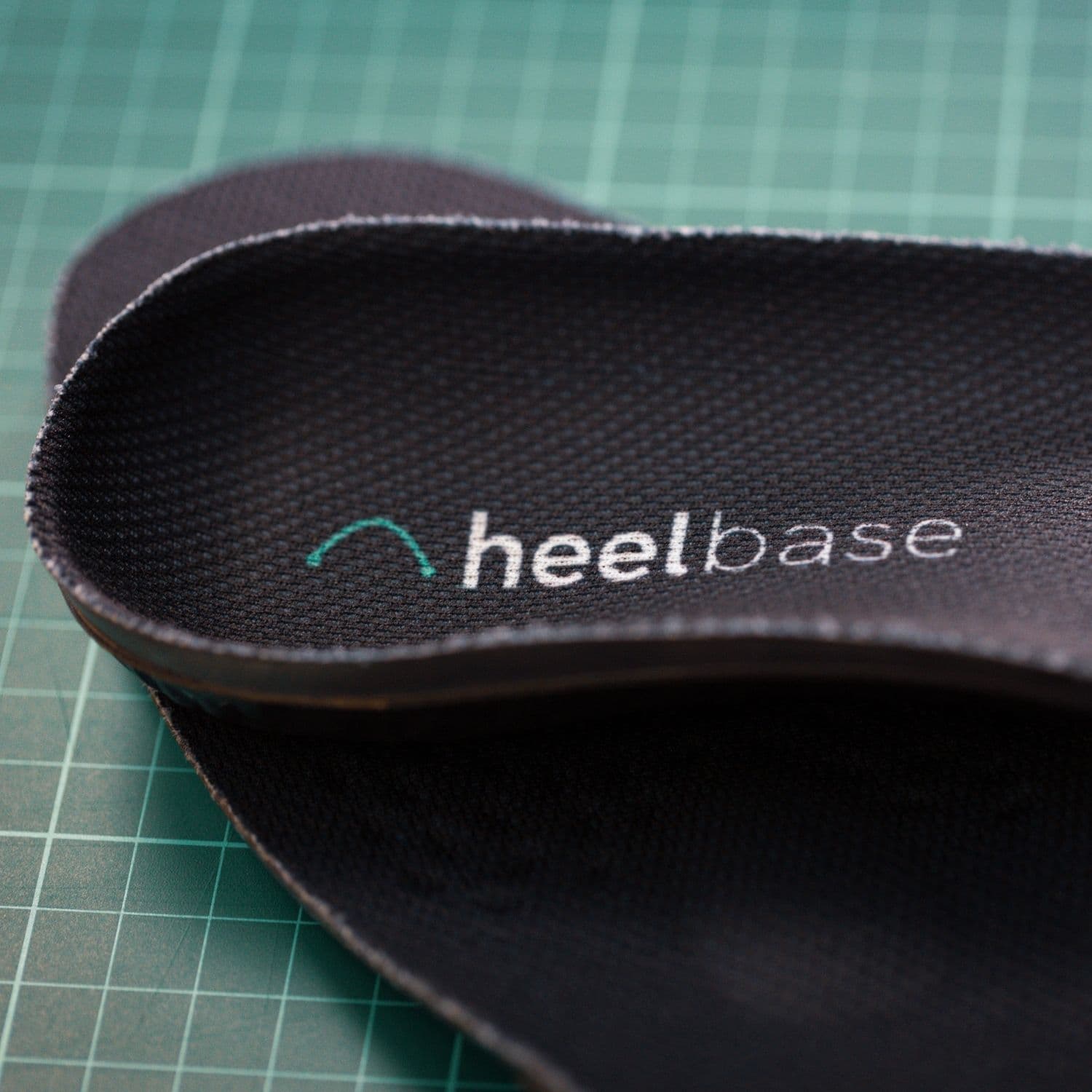Close-up of the HeelBase logo on the textured Stance top cover