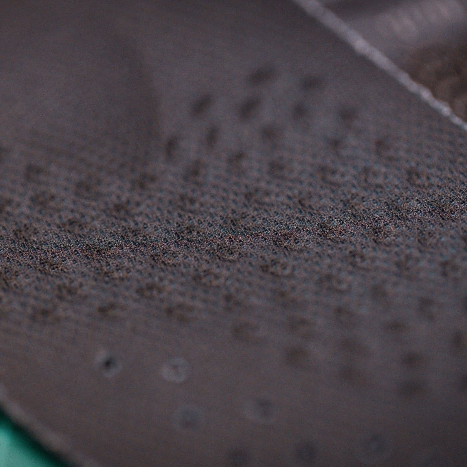 Macro close-up of the textured material on the HeelBase Stance top cover
