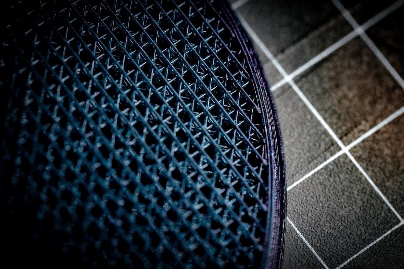 Extreme close-up of the precisely printed edge and lattice on a HeelBase Drive pickleball insole