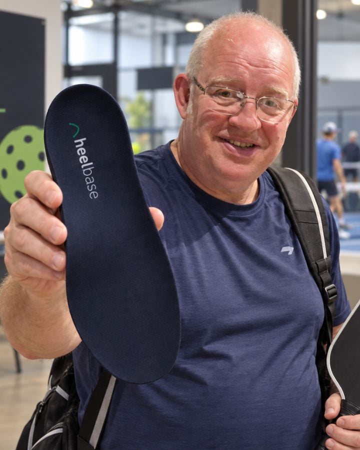 David holding a HeelBase Apex insole