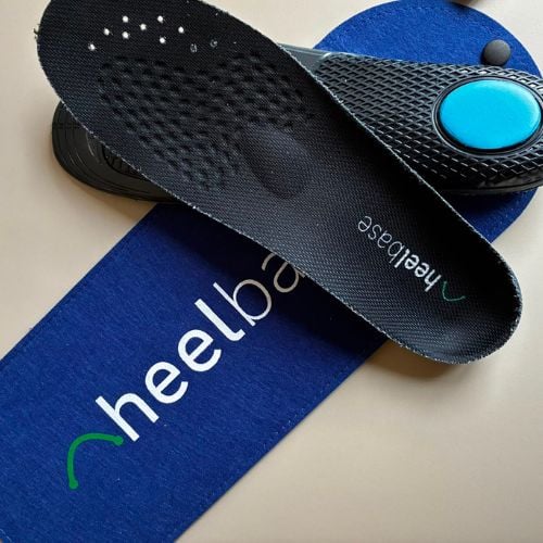 Customer photo showing Stance insoles next to HeelBase pouch