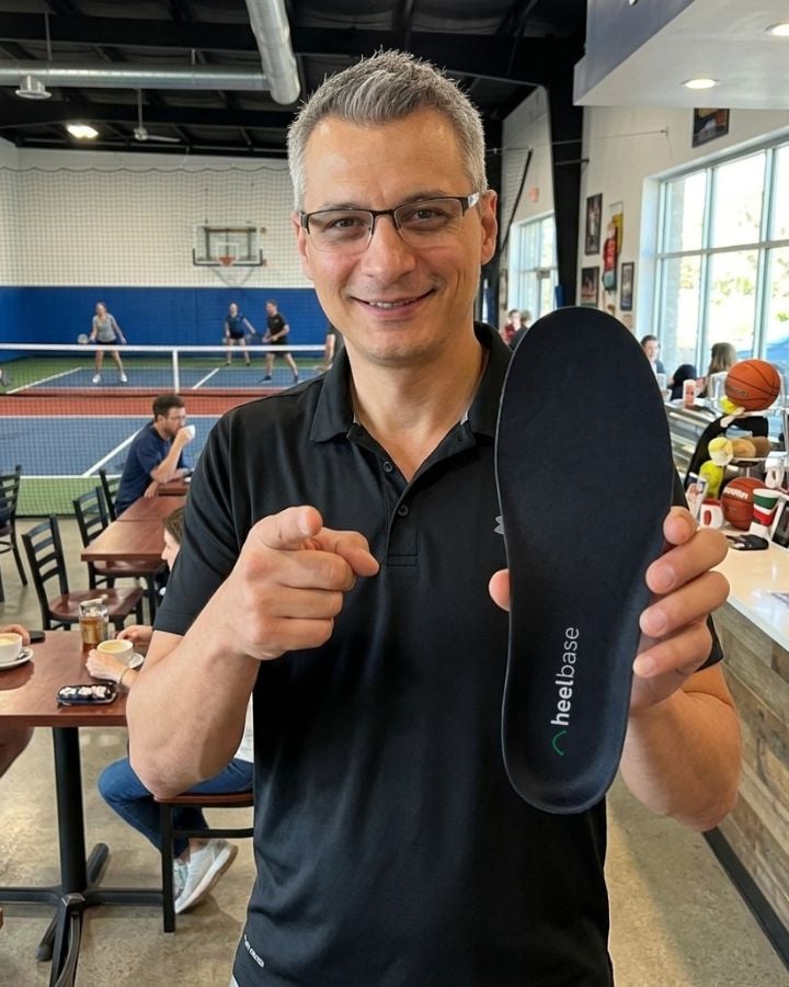 Mario holding a pair of HeelBase Apex insoles