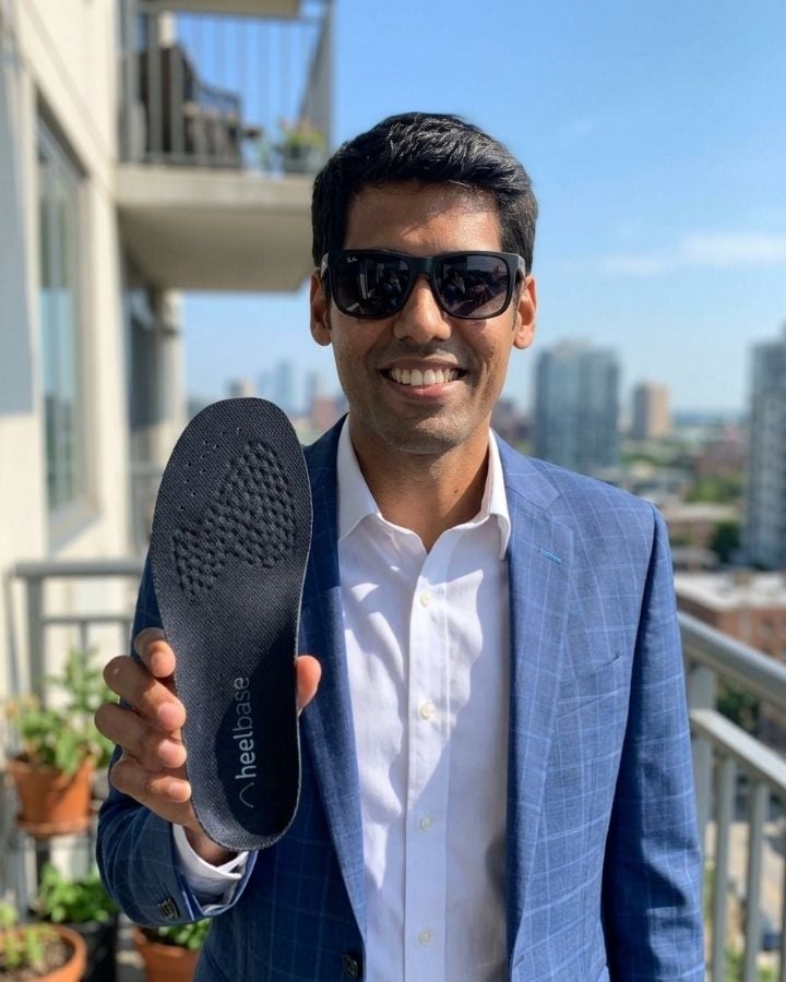 Shashank holding a pair of HeelBase Stance insoles