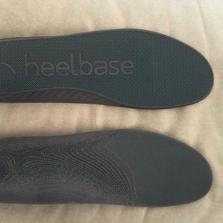 Customer photo showing the top and bottom of HeelBase Drive insoles